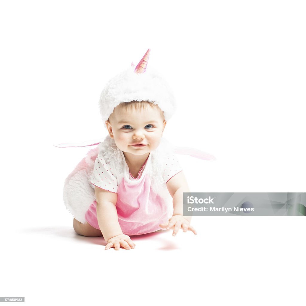Улыбающегося ребенка в костюм a unicorn - Стоковые фото Единорог роялти-фри