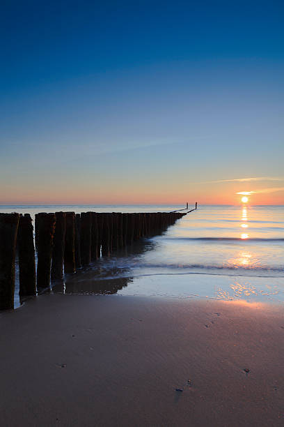 istock waves breaking on a wooden breakwater along the Dutch coast 174859074
