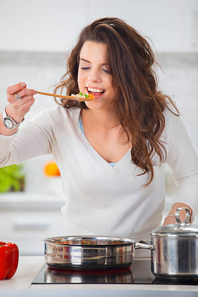 istock Young Woman Tasting The Lunch 174859247