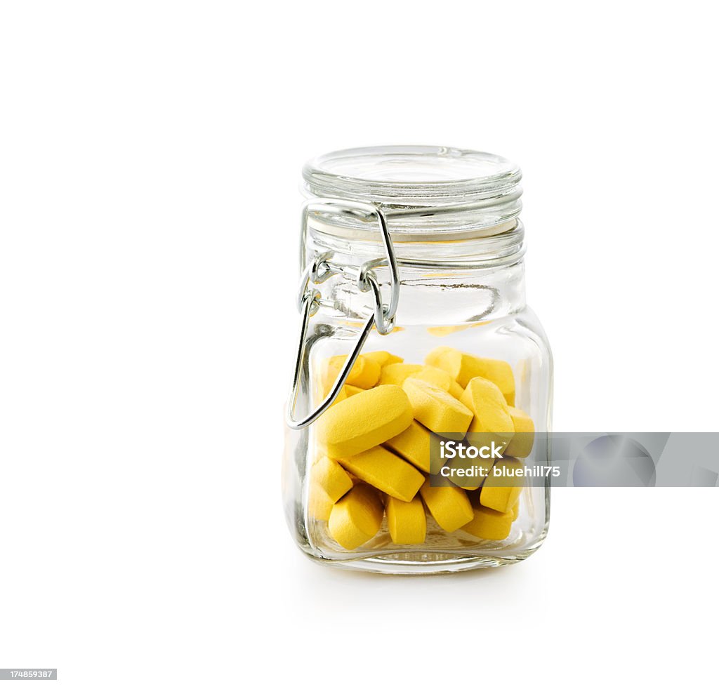 Pillole in un barattolo di vetro - Foto stock royalty-free di Alimentazione sana