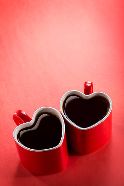 This is a photo of 2 heart shaped coffee cups sitting on a red background. There is a lot of space above for copy.Click on the links below to view lightboxes.