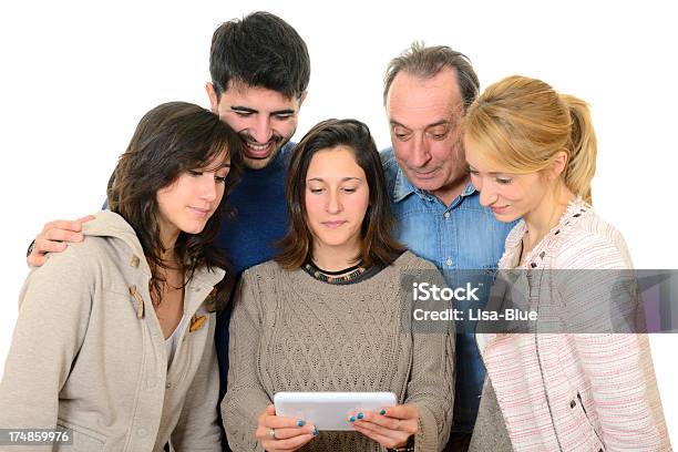 Happy Family Using Digital Tablet Stock Photo - Download Image Now - Digital Display, Senior Adult, Young Adult