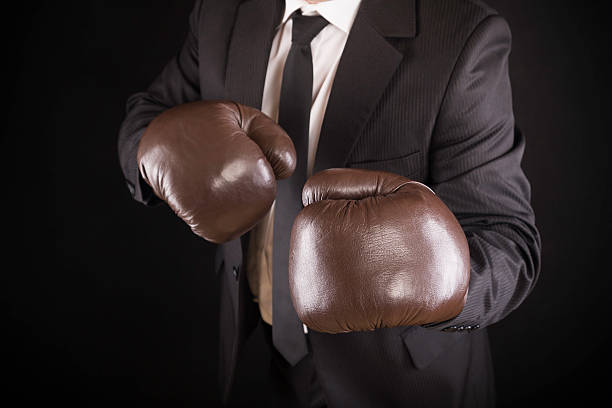istock businessman with boxing gloves 174860099