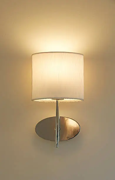 Photo of champagne coloured wall lamp