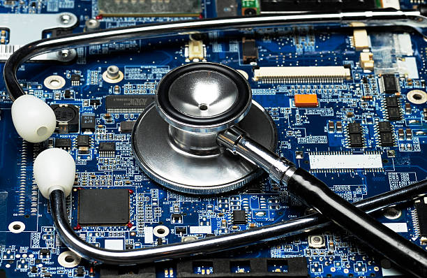 computer board and stethescope stock photo