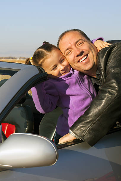 istock Father And Doughter with sport car 174860456