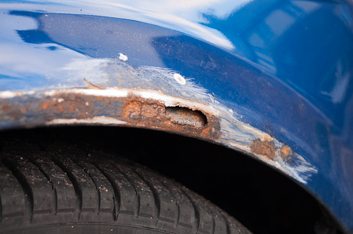 In the United Kingdom, despite the cold weather, motorists are too lazy to mount proper winter tires. Consequently, the roads, in winter and icy conditions, are extensively sprayed with grit salt. Motorists pay then the toll when all the salt, sprayed around the wheels, corrodes the car. In the photo, an extensive rust damage is visible, after the rust has been abraded away, before painting over.