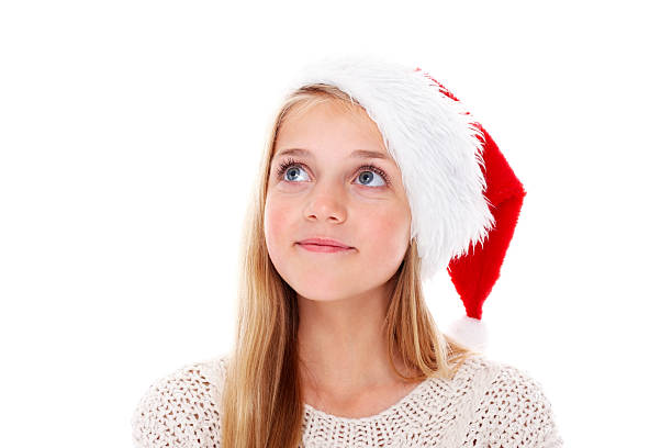 istock Cute little girl wearing Santa hat looking away at copyspace 174860809