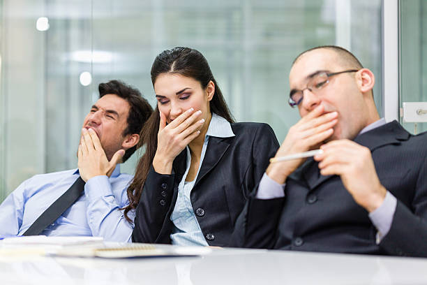 istock Tired business people yawn 174860977