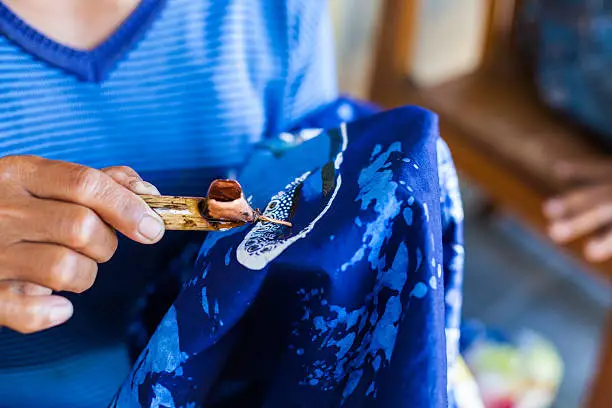 Woman making a traditional batik