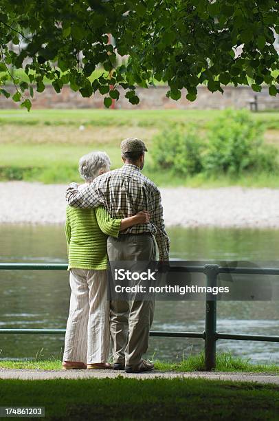 Senior Couple By A River Stock Photo - Download Image Now - 70-79 Years, Active Seniors, Adult