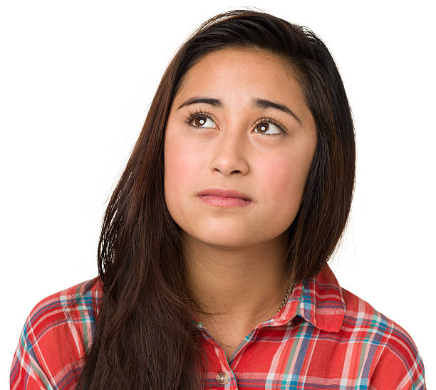 istock Young, dark haired woman thinking 174861500