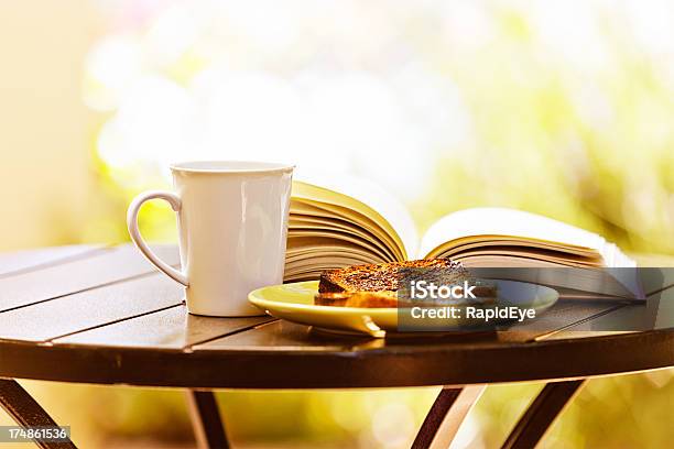 Perfect Relaxation With Book Buttered Toast And Steaming Drink Stock Photo - Download Image Now