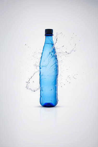 istock Bottles with mineral water and splash around it 174861735