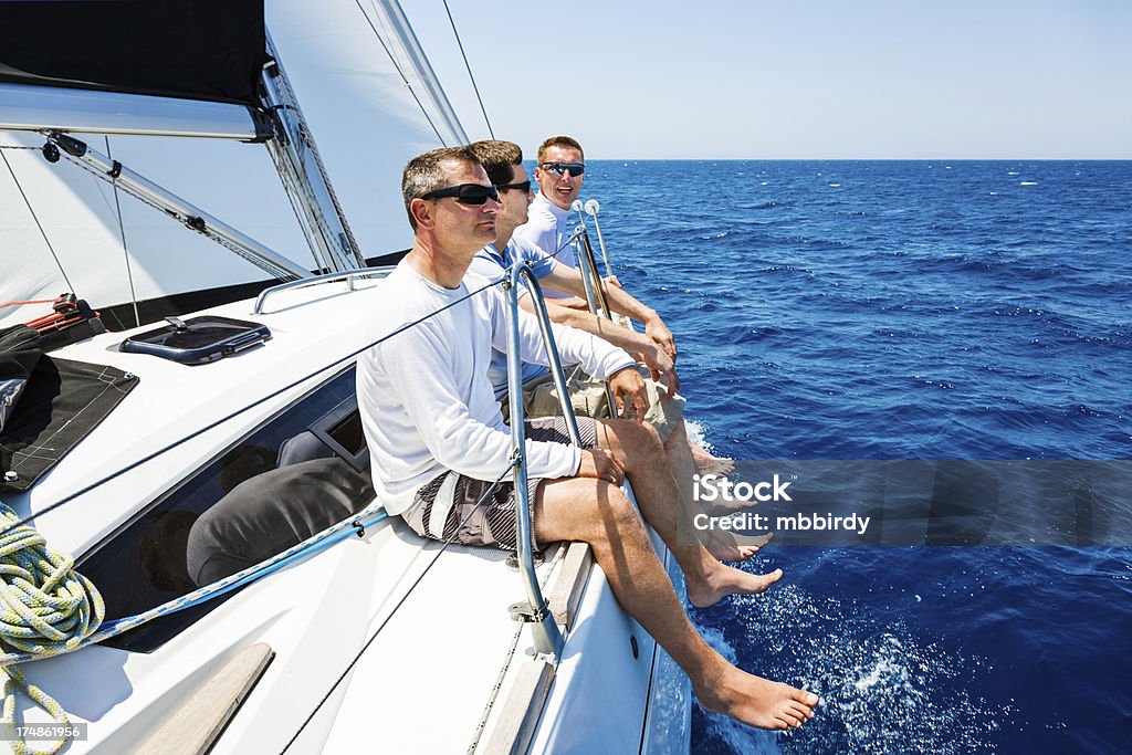 Sailing crew on sailboat Sailing crew on sailboat. http://santoriniphoto.com/Template-Sailing.jpg Adriatic Sea Stock Photo