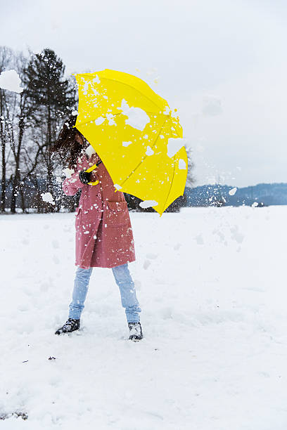 istock Cute young woman was hit with  snowball 174862537
