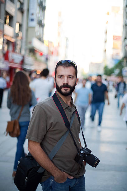 istock young photographer looking around 174862650