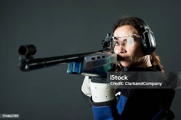 Woman Sport Shooter With A 22 Rifle Stock Photo - Download Image Now - 40-49 Years, Adult, Adults Only