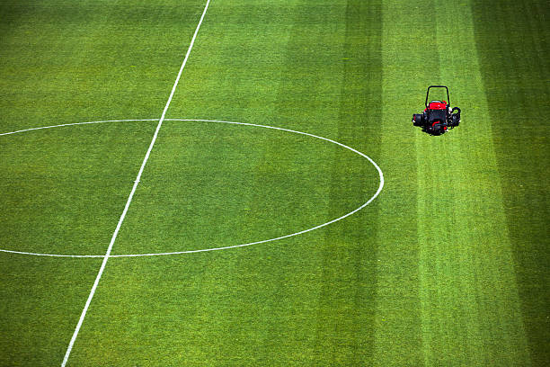 istock Cutting grass turf lines on a sports field 174862864