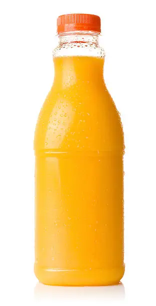 Bottle of cold orange juice isolated on a white background. Condensation droplets visible on the bottle.