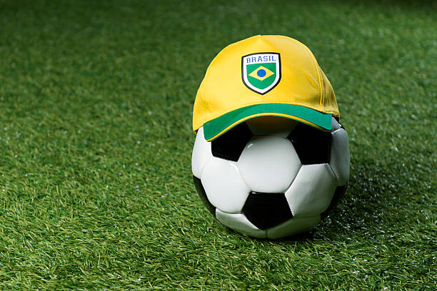 istock Soccerball on the grass with a cap 174863756
