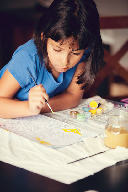 istock child painting by numbers 174864161