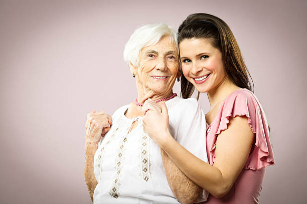 istock Granddaughter hugging her grandmother 174864527