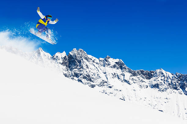 istock Freestyle snowboarder in a jump 174864978