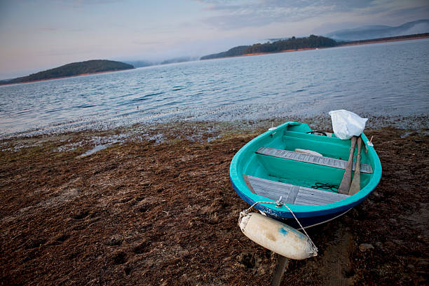 istock old rowboat by the lake 174865040