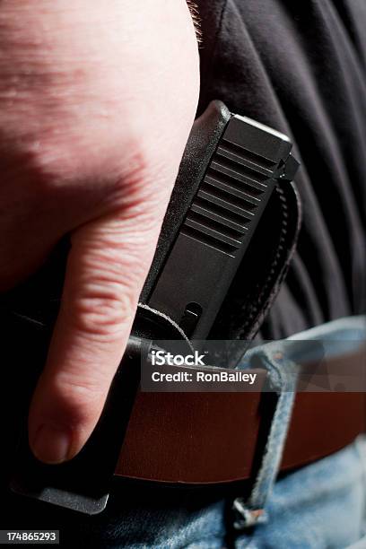 Concealed Carry Firearm Drawn From An Insidethewaistband Holster Stock Photo - Download Image Now