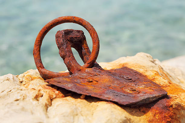 istock worn out rusty ship dock metal ring in rock 174865358