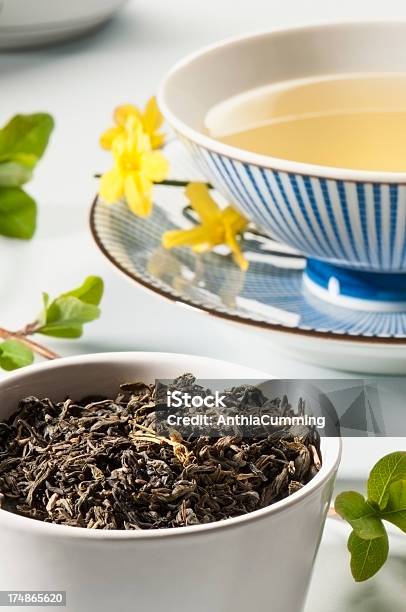 Jasmine Green Tea Leaves And A Cup Of Green Tea Stock Photo - Download Image Now - Antioxidant, Camellia sinensis, Cup