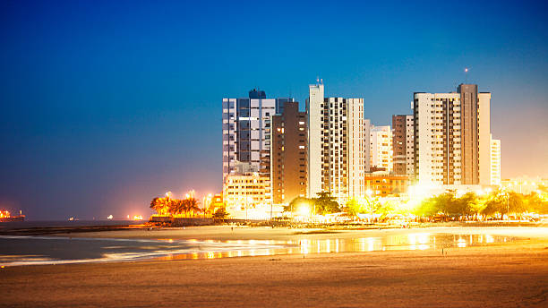 Sao Luis skyline. "View to Praia Ponta D'Areia by night.Sao Luis, MA, Brazil.more dark alleys:" sao luis stock pictures, royalty-free photos & images