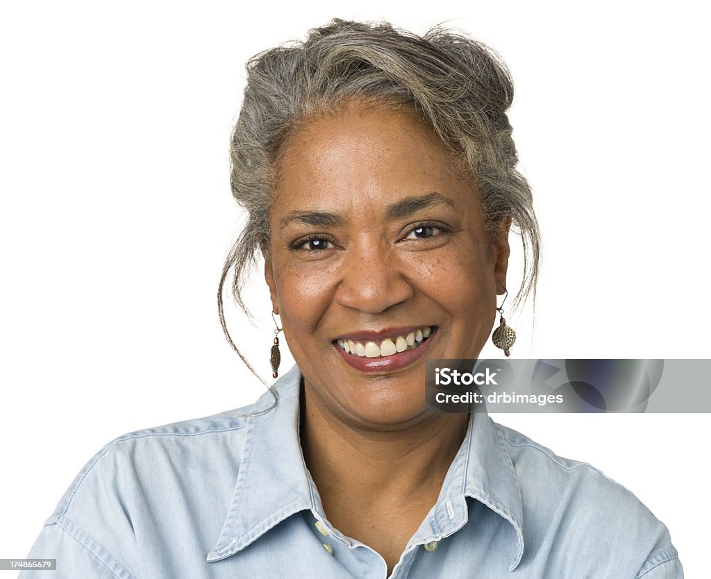 Smiling Mature Woman Head And Shoulders Portrait Portrait of a mature woman on a white background. White Background Stock Photo