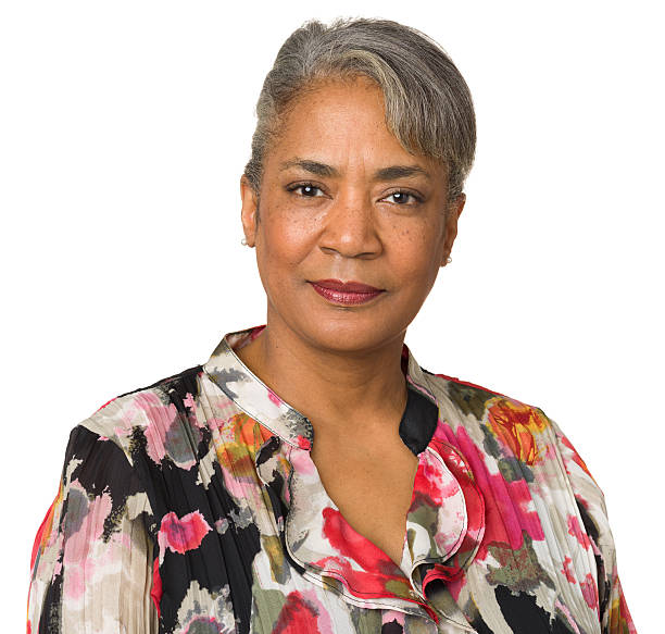 istock Middle aged woman in floral blouse looking into camera 174865714