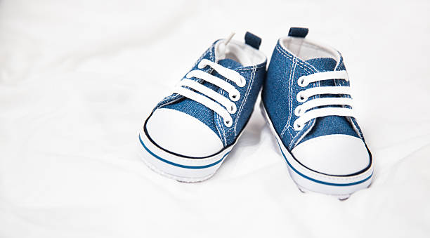 Baby shoes on blanket