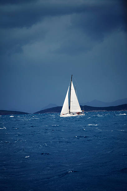 istock Sailing team on yacht and stormy weather 174866234