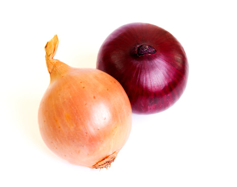 Red and gold onion on white