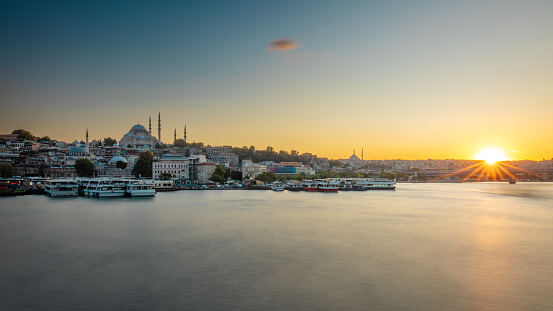 Sunset over the Golden Horn Bridge and the Suleymaniye Mosque. Istanbul, Turkey.