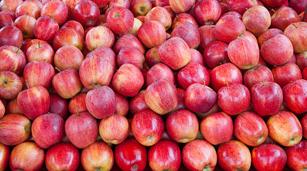 Fresh fruits on market stall: fuji apples stock photo