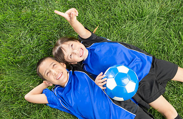 istock Young boy and girl taking a break from soccer 174867186