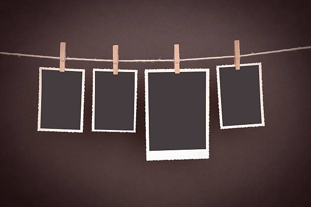 istock old blank photos hanging on clothesline with clipping path 174867556