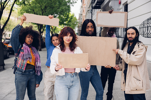 People holding cardboards with blank copy space.