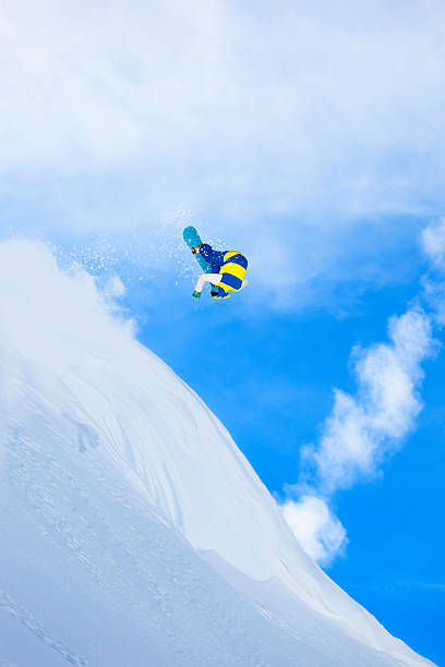 istock Freestyle snowboarder in a jump 174867645
