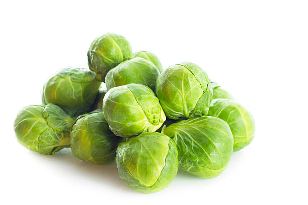 istock Pile of Brussels Sprouts On White 174867783