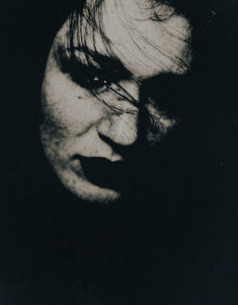 istock The woman in the darkness. 1748677963