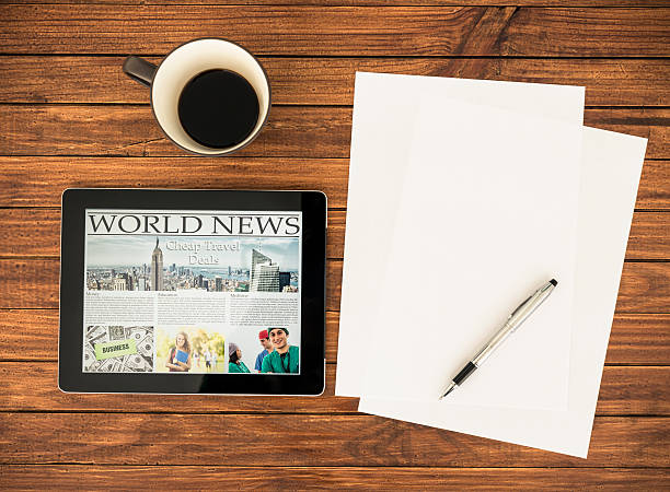 istock Desk with World news on the digital tablet 174867805