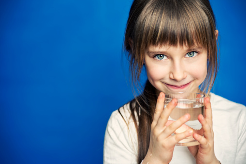 Little girl drinking water