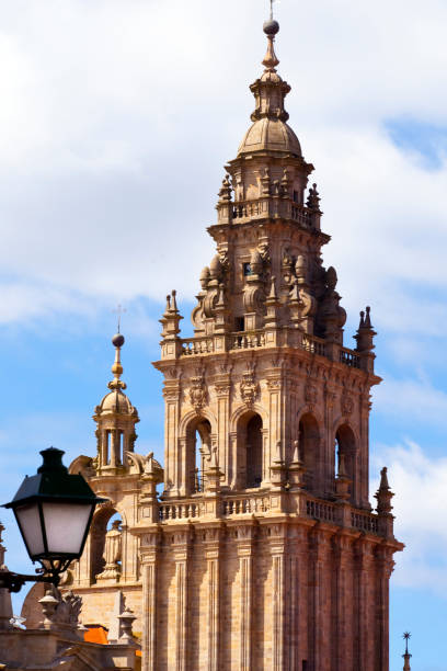 Bell tower of Santiago de Compostela cathedral, A Coruña province, Galicia, Spain.  Camino de Santiago. Retro style street light.