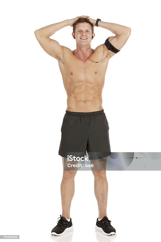 Glücklich männliche Athlet mit einem MP3-player auf dem arm - Lizenzfrei Accessoires Stock-Foto